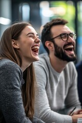 Fototapeta premium Two friends share a joke, with one laughing heartily.