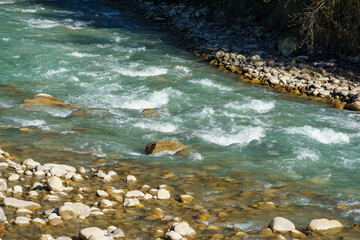 Picturesque moutain Chegem river flows through rocky canyon, surrounded by autumn foliage and rugged cliffs. Kabardino-Balkaria, Chegemsky district