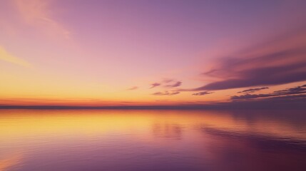 Obraz premium Serene Sunset Over Calm Water with Vibrant Pink and Purple Sky