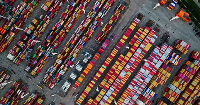 Aerial view of a container terminal with colorful cargo boxes neatly stacked