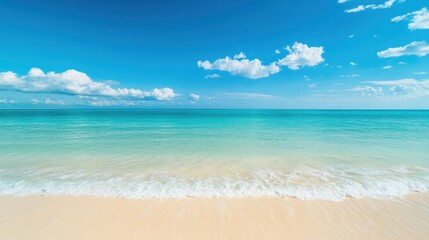 Fototapeta premium Serene tropical beach with crystal-clear turquoise water, soft white sand, and gentle ocean waves under a bright blue sky