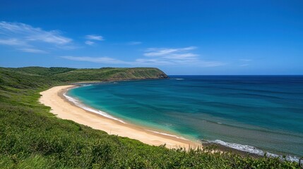 Obraz premium Tranquil ocean bay with a golden sandy shore and lush greenery lining the coastline