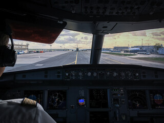 Pilot's hand accelerating on the throttle in  a commercial airliner airplane flight cockpit during...