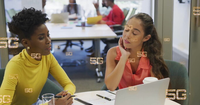 Image of 5g over diverse colleagues discussing work in office