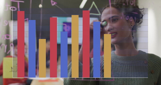 Image of financial data processing over diverse colleagues having meeting in office - Powered by Adobe