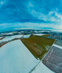 High resolution stitched winter drone panorama captured in flight near a chapel at Landau an der...