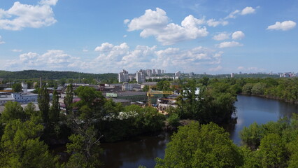 Fototapeta premium Aerial View of Dnipro River, Ukraine – Summer Greenery and Clouds