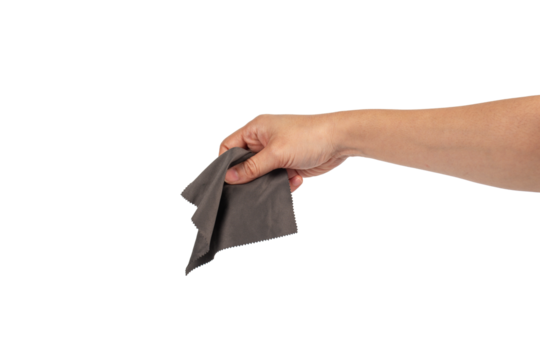 Hand and crumpled microfiber cleaning cloth, isolated on transparent background