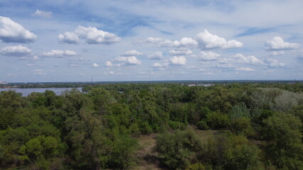 Obraz premium Aerial View of Dnipro River, Ukraine – Summer Greenery and Clouds