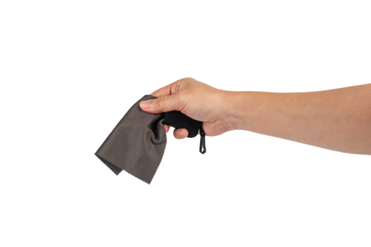 Hand and crumpled microfiber cleaning cloth, isolated on transparent background