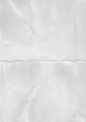 Blank folded light gray paper sheet. Empty crumpled white grey paper background texture 