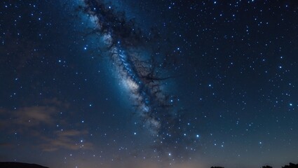 Fototapeta premium Stunning view of a star-filled night sky showcasing the majesty of the Milky Way and twinkling celestial bodies.