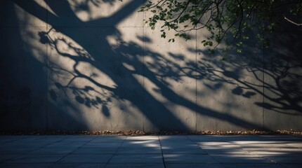 Shadows of trees on a concrete wall at dusk creating a serene yet eerie atmosphere with room for text or design elements.