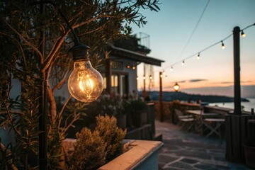 Warm glow of a light bulb in the evening, casting a cozy ambiance on the surrounding environment, evening, soft