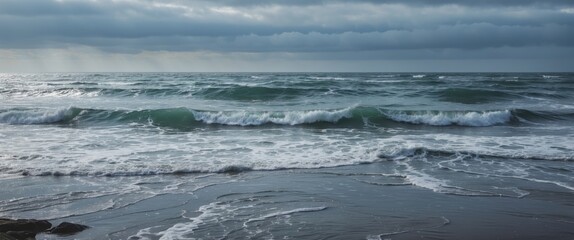 Gentle sea waves under cloudy skies at summer's end with ample space for text, conveying a serene coastal atmosphere.