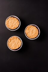 Fototapeta premium Warm pastries arranged elegantly on dark surface, showcasing gol