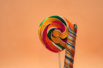 Close-up of two swirled lollipops in bold. Themes related to sweets, childhood, nostalgia,...
