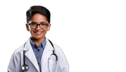 Portrait of a smiling young boy dressed as a doctor