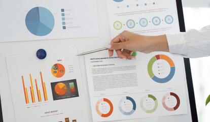 Detailed view of financial charts and data analysis in a meeting