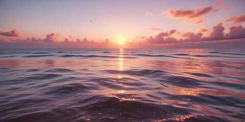 Fototapeta premium Vibrant orange and pink hues reflecting on calm ocean water, water, hues