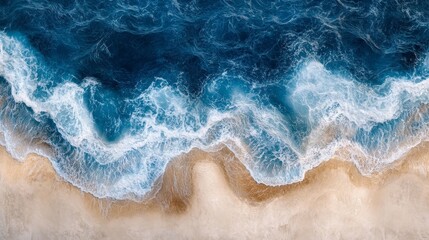 Fototapeta premium Aerial view of icy blue sea and sandy beach, with wave-like fluid patterns and snow-covered mountains in shades of white to brown, creating a stunning contrast between land and sea.