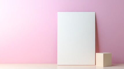Minimalistic white poster and cube against a pink wall, showcasing modern design in a simple setting.