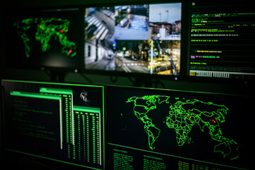 Global cyber attack threatening world map on multiple computer screens showing internet security vulnerability detected by hacker