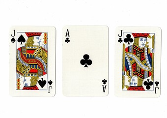 A hand of three playing cards isolated on a white background.