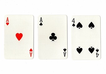 A hand of three playing cards on a white background.