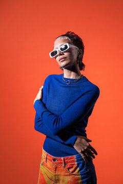 Trendy Woman in Colorful Trousers and Modern Sunglasses