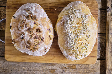 homemade bread decorated with edible flowers. Daisies.
