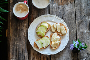 Peanut butter toast with apple and banana.