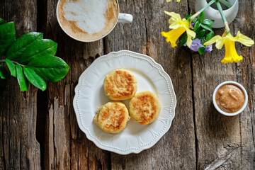 Syrniki on a white plate. Top view.