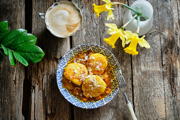 Syrniki with sea buckthorn sauce