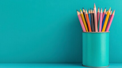Fototapeta premium Vibrant Collection of Colorful Pencils in a Turquoise Container