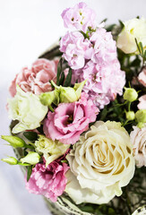 Bouquet of beautiful tender flowers - white and pink roses and lisianthus