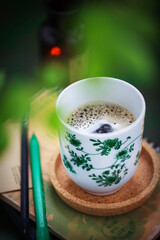Cozy ceramic cup of cofee on spring background