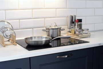 Cooking food on a modern induction stove.