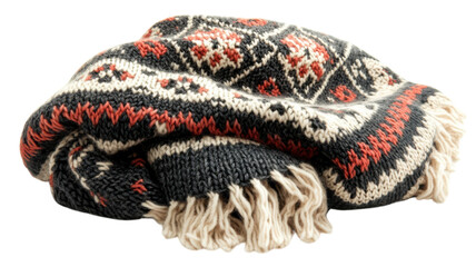 Cozy knitted blanket with intricate patterns and fringe laying on a surface ready for use during chilly evenings