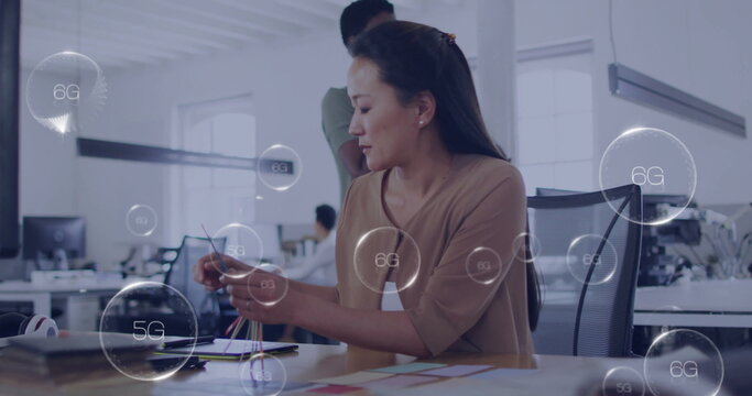 Working in modern office, woman surrounded by 5G and 6G network image