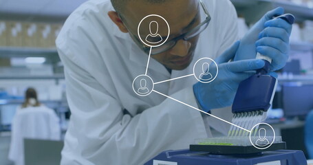 Image of media icons over biracial male scientist doing experiments in lab