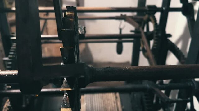 Close-up of the gears inside a working church clock.