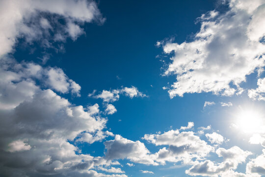 Partly cloudy sky background photo. Weather forecast concept.