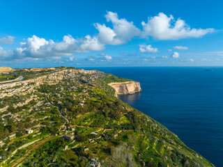 Drone aerial view of famous Dingli cliffs. Mediterranean sea, blue sky. Malta island