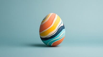 Obraz premium Colorful Swirled Easter Egg on Soft Blue Background