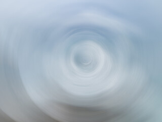 Spiraling clouds create a mesmerizing dance in the sky