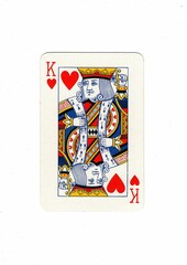 A vintage playing card isolated in the centre of a white background.