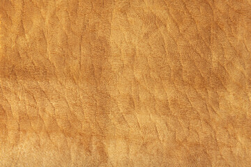 Close up high resolution photo of yellow suede leather material texture
