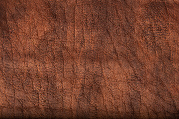 Close up high resolution photo of orange brown suede leather material texture