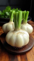 Close-up view of fresh garlic bulbs with green shoots on a wooden kitchen table